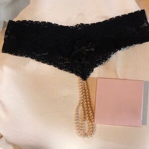 Victoria’s Secret black lace & pearls open crotch thong, size small.